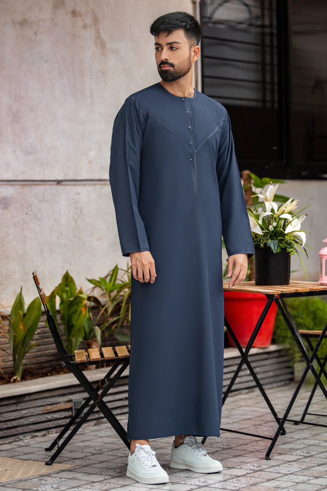 Front view of navy blue thobe featuring round neck, touch buttons, and premium-quality stitching for formal and casual occasions.