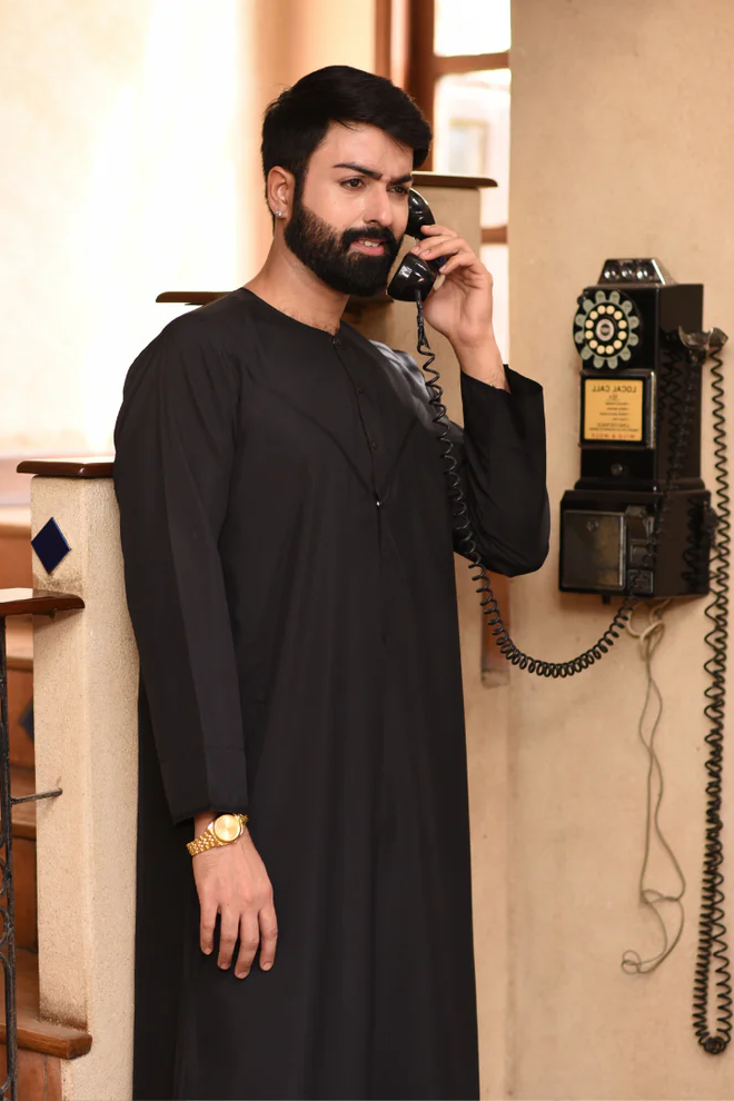 Timeless black thobe by Aamsah, crafted with attention to detail, perfect for a contemporary yet traditional look, ideal for various occasions.